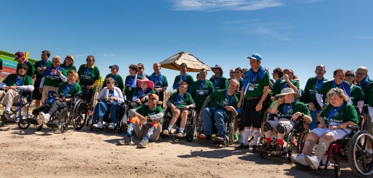 A group of bike to the beach riders of ALL abilities posing after completing the ride